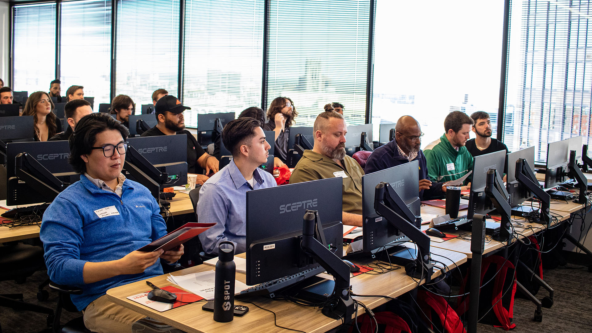 Spot employees at a training session for TMS software