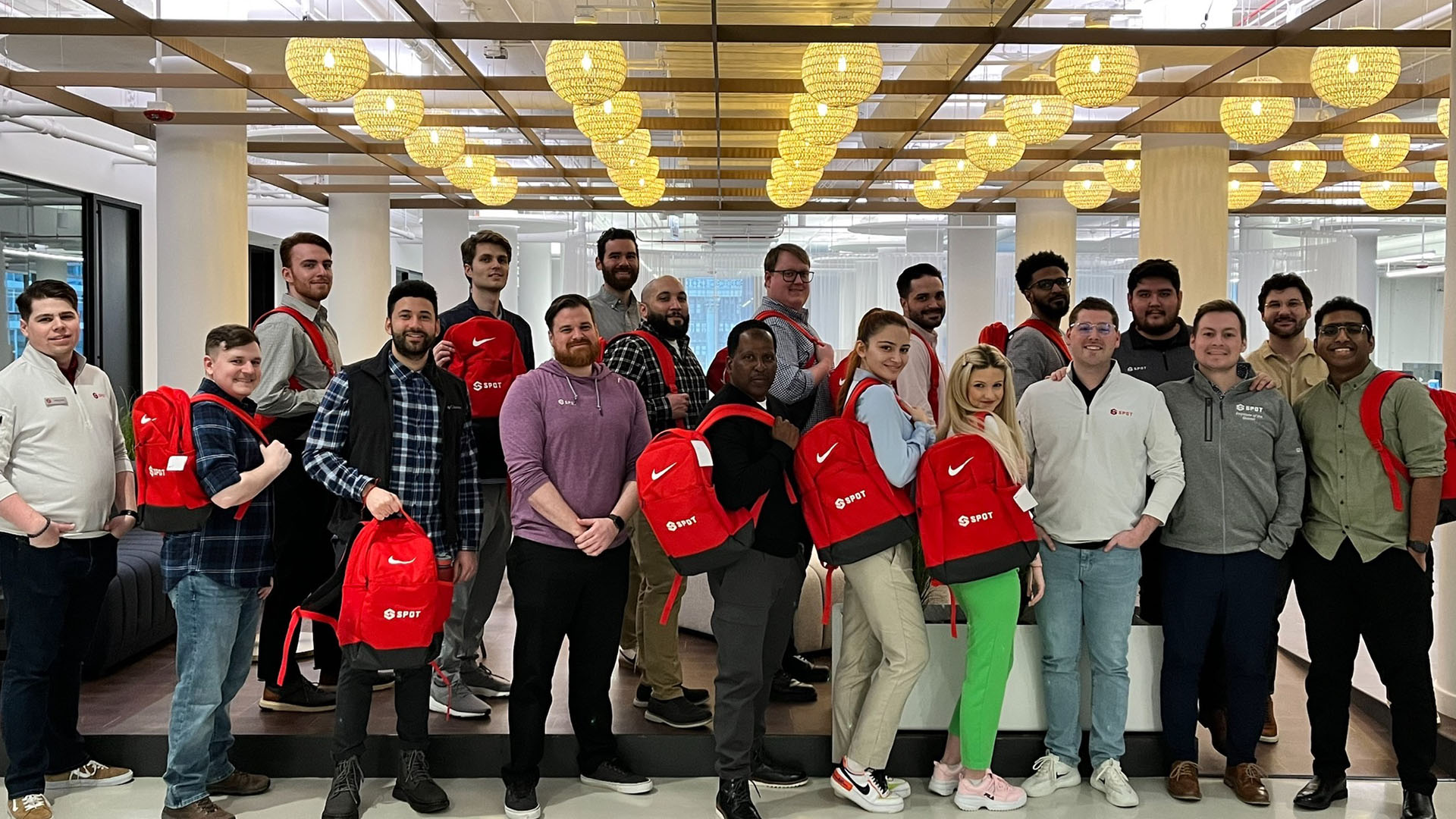 19 Spot employees showing off some giveaway items